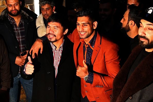 Manny Pacquiao et Amir Khan à Fiztroy Lodge Club de boxe amateur. Manny Pacquiao et Amir Khan à Fiztroy Lodge Club de boxe amateur.